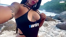 Young brunette flaunts her pierced vagina at the seaside