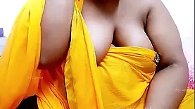 Mature Indian woman's breasts exposed